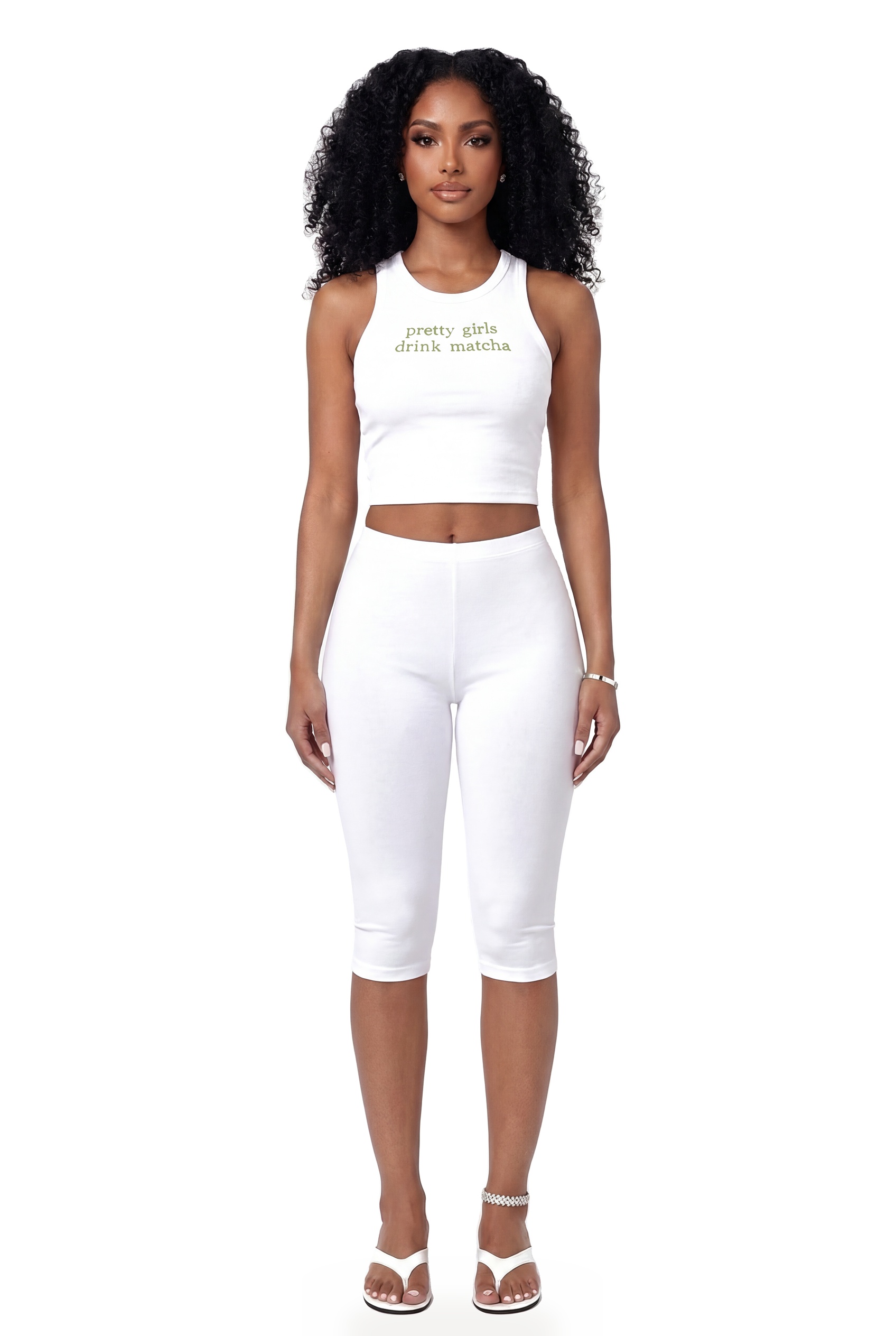 Model wearing The Pretty Girl Tank Top, a white ribbed tank with a Pretty Girls Drink Matcha graphic, and white capri leggings
